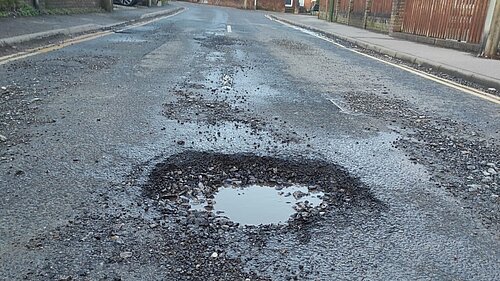 Photo: Pothole on Trinity Road, Hurstpierpoint which was the recent subject of an ITV News report on poor road maintenance in West Sussex