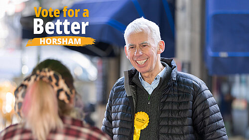 John Milne at Horsham Market with logo